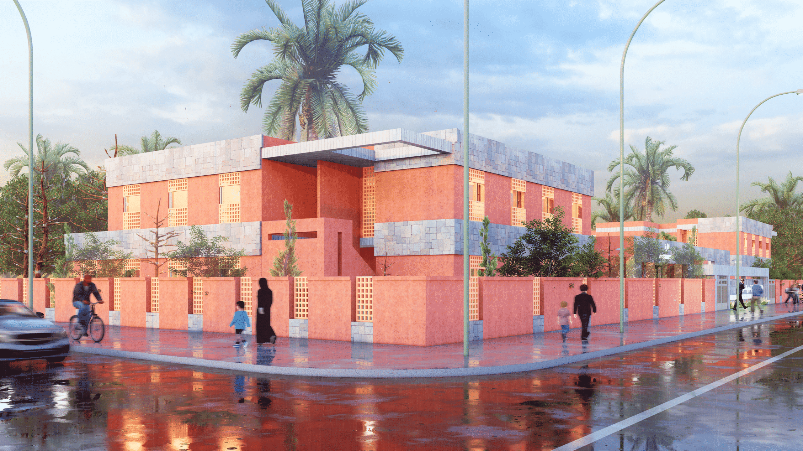 Un bâtiment moderne rose et gris avec des palmiers, entouré d'une clôture assortie, se trouve dans une rue humide où les gens marchent et font du vélo sous un ciel nuageux.