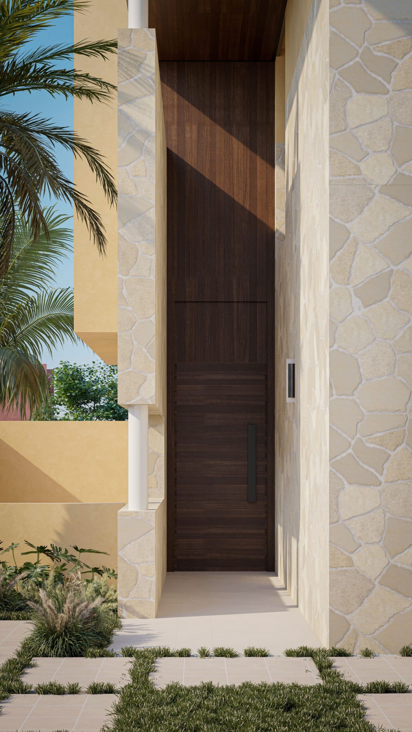 ARCHITECTURE VILLA Une entrée moderne avec une haute porte en bois foncé encastrée dans un mur de pierre, avec des carreaux de pierre géométriques sur le sol et de grandes feuilles de palmier partiellement visibles sur le côté gauche.